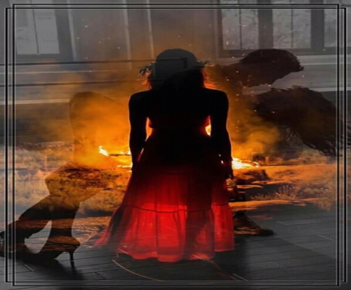 A silhouette of a person in a hat and red dress is superimposed on an image of a burning object, creating a double exposure effect.